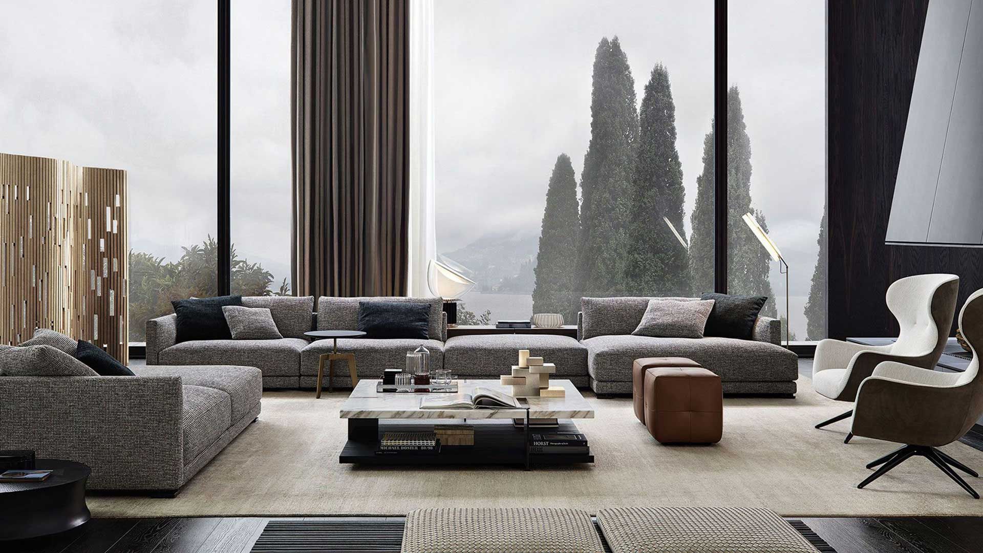 ampio soggiorno con grande divano spazioso grigio